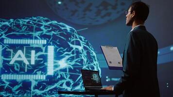 Startup employee looking over business charts, using AI software to take data driven decisions in tech industry. IT expert developing innovative artificial intelligence solutions for company, camera B photo