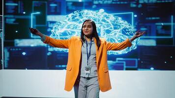 Speaker talking with world leading technology experts and innovators meeting at event to do deep dive into artificial intelligence technology. Expert showcasing latest innovations in AI, camera B photo