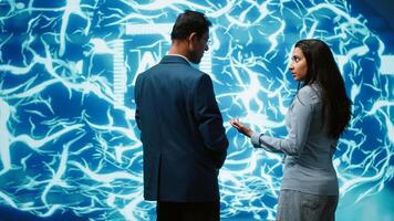 Teamworking colleagues implementing artificial intelligence parallel processing, breaking up complex computational tasks enabling AI systems to process more input data faster, camera A photo