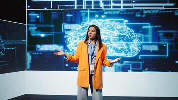 Lively speaker talks at AI event gathering tech startups managers, investors and academics. Expert hosts sessions geared towards helping IT business leaders tap into artificial intelligence, camera B photo