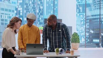 Business clients and a realtor meeting to plan a property investment, negotiating the leasing contract terms and reaching an agreement. Hunting for real estate high class office space. Camera B. video