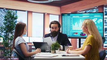 Financial adviser conducting audit of clients income, developing predictive financial models. Agent crafts customized economic strategies based on customers goals and risk tolerance, camera B video