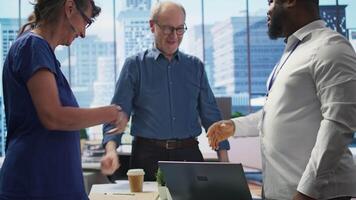 Senior people consulting financial advisor about retirement and pension planning, shaking hands for securing the future with life insurance and savings. Financial options in modern office. Camera B. video