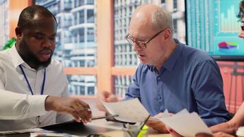 Mature couple receiving professional advice on retirement planning, discussing potential comprehensive strategy to secure their savings and investments for the long term. Counseling. Camera A. video