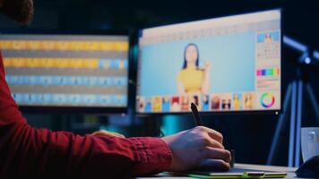 Expert photo editor zooming in on images and fixing faulty spots using graphic tablet in home studio, close up. Professional photographer expertly refining pictures with stylus on touchscreen device