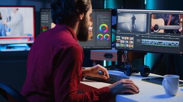 editor selecting key frames to use while doing montage, using specialized software applications. Freelancer using editing tools on computer to cut movie project footage in office photo