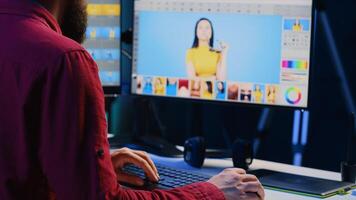 Photographer using advanced photo editing software to make improvement to images quality. Photo editor utilizing specialized photographs retouching application to make adjustments