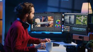 editor correcting faulty footage, grading and coloring, enjoying cup of coffee in creative studio. Videographer adding special effects to clips, drinking hot beverage in media company office photo