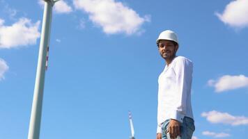 Portrait of indian engineer at wind farm video