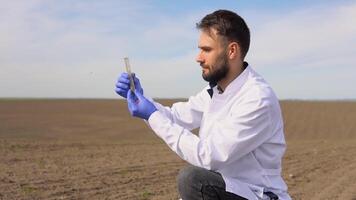 Scientist checks the quality of the soil for control soil quality before seed plant. Future agriculture concept. Smart farming, using modern technologies in agriculture video