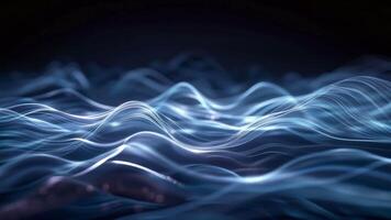 Abstract glowing blue waves and particles on dark background, representing technology, data flow, and digital communication. video