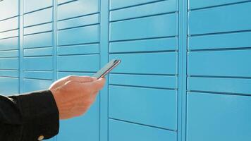 Parcel locker, receiving online order by opening a automated mailbox through an application on mobile phone video