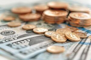 There is a stack of money and coins placed on a wooden table photo