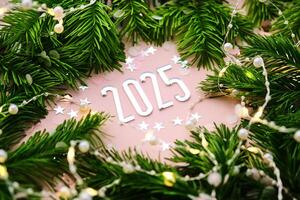 New Year 2025 pink background. Number of the coming year. photo