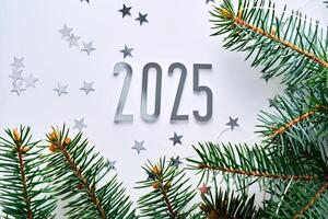 Abstract light Christmas background with stars and a Christmas tree with the year number 2025. photo