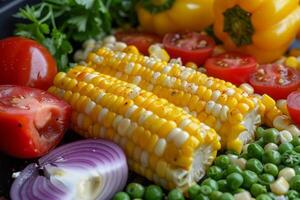 Boost your nutritional intake by incorporating an array of colorful plantbased ingredients like corn, tomatoes, and peas into your vegan or vegetarian meals for added antioxidants and vitamins photo