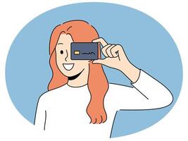 Smiling woman with credit card in hands vector