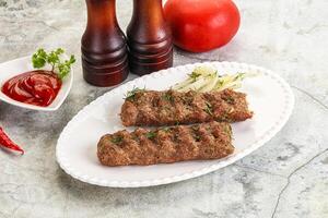 Kebab with beef served onion photo