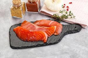 Salted raw salmon fillet appetizer photo