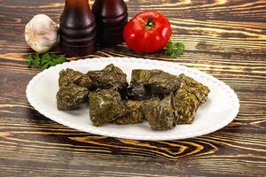 Stuffed dolma - meat in grape leaves photo