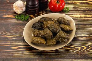 Stuffed dolma - meat in grape leaves photo
