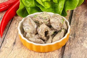 Chicken liver with cream sauce photo