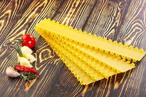 Uncooked raw Lasagna dry sheets photo