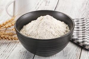 Wheat flour heap for bake photo