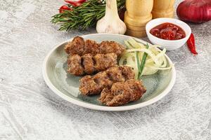 Beef kebab minced meat with onion photo