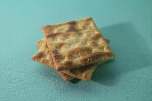 close up of cracker biscuit on green background photo
