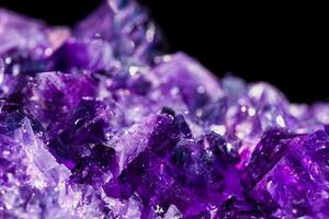Close-up of Amethyst Crystal with Selective Focus, Isolated on Black Background photo