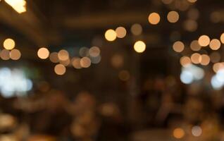 Minimalist Wooden Tabletop in Cafe Setting with Golden Bokeh Background photo
