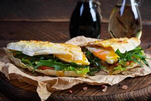 Grilled stuffed lavash with herbs, tomato and egg. Lavash sandwich photo