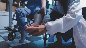 Physical therapist helps a male patient use a walker to practice walking. Support yourself from recovery from sore legs and ankles. Physical therapy service concept. video