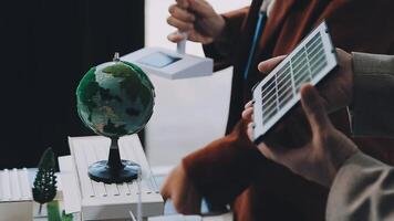 Green energy business company meeting with business people planning and discuss marketing of sustainable and renewable clean energy product with solar cell and wind turbine generator. Trailblazing video