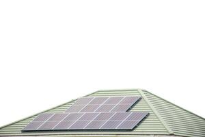 Installing a solar cell on a roof. Solar panels on roof. Modern house with modern solar panels on tile roof and wall against clear sky background 2025. photo