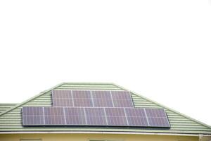 Installing a solar cell on a roof. Solar panels on roof. Modern house with modern solar panels on tile roof and wall against clear sky background 2025. photo