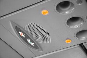 Symbol light of take belt and no smoking with employee call button on the airplane, Interior of an airplane, Cabin sign light of no smoking and fasten seatbelt while airplane take off and landing 2025 photo