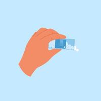 Hand holds bottle with pills spilling out. Open container with antibiotic tablets vector