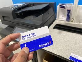 Albury, New South Wales, Australia - 24 June 2024 - Office work is a chain of Australian office supplies stores, image shows printing card, print and copy self serve makes printing easy. photo