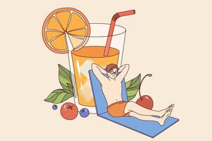Man relaxed on beach and drinks orange juice from giant glass, enjoying sunny weather vector