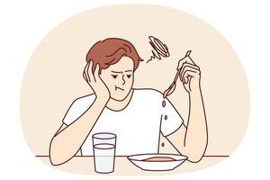 Man suffers from lack of appetite sitting at table in kitchen and does not want to eat breakfast vector