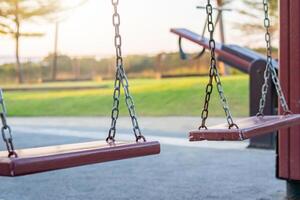 Empty chain swing in the playground photo