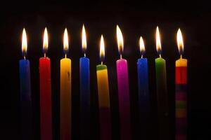 A set of lit Hanukkah candles lined up. In the form of dark, foreboding, contrasting colors. photo