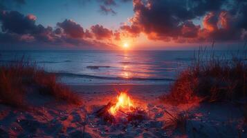 Bonfire on the beach at dusk with friends gathered around Toast marshmallows and enjoy the warm evening. photo