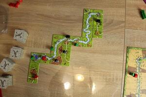 board game carcassonne with overhead game elements laid out photo