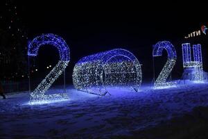 Neon Street Figures Christmas holiday atmosphere. Numbers 202 New Year photo