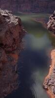 A stunning canyon with a serene lake nestled in its depths video