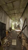 A deserted hallway filled with scattered debris and abandoned objects video