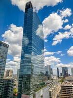 hhigh-rise office tower on the blue sky with clouds in Warsaw. High quality photo